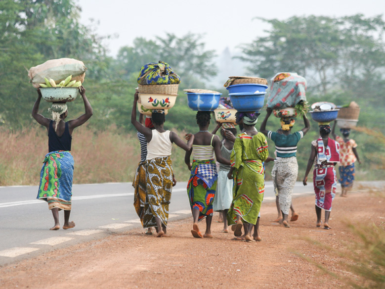 Women walking carrying fresh food